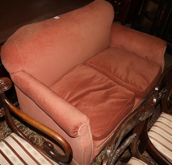 Pink settee, on claw and ball feet, with cushions
